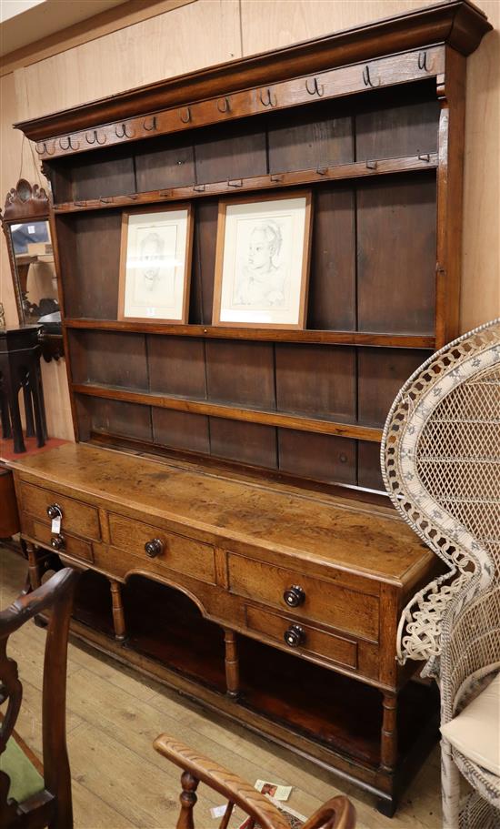 An 18th century oak potboard dresser W.185cm